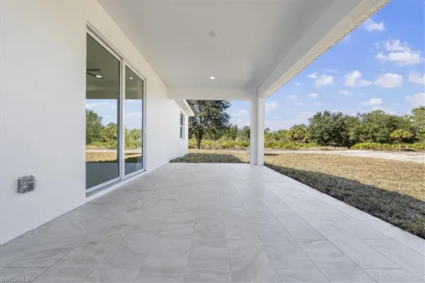 a view of hallway with wooden floor