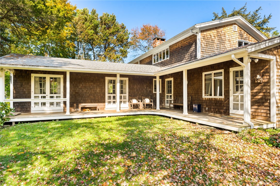 144 East Beach Road Charlestown, RI 02813 - Photo 3 of 45 Double doors allow two guest rooms access to the beautiful porch. The single doors function as a a main entry to the center hall, and one to the kitchen.