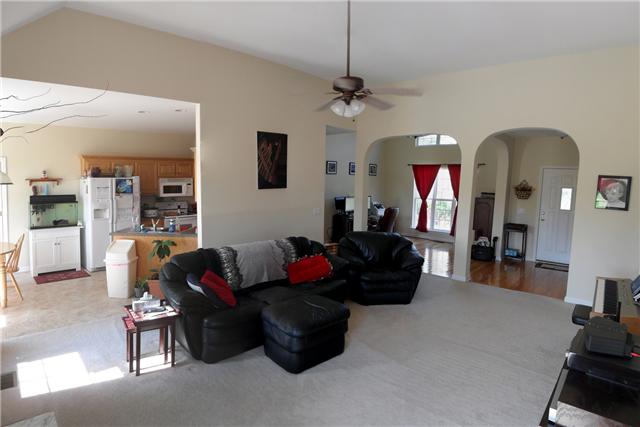 82 Bradshaw Road Lebanon, TN 37087 - Photo 12 of 20 a living room with furniture and a chandelier
