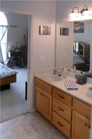82 Bradshaw Road Lebanon, TN 37087 - Photo 15 of 20 a bathroom with a double vanity sink and a mirror
