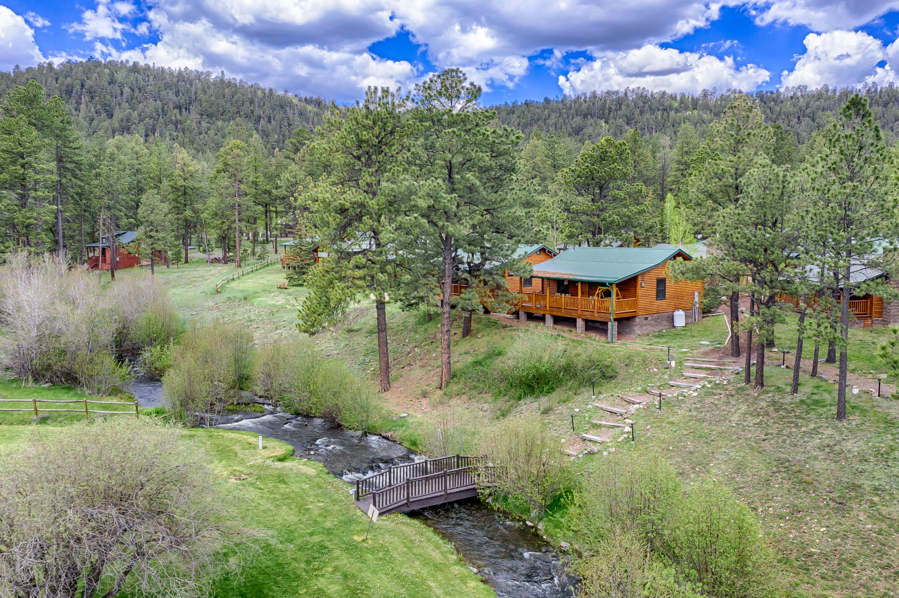 1120 Main, Unit 108 Greer, AZ 85927 - Photo 11 of 35 an aerial view of a house with a yard