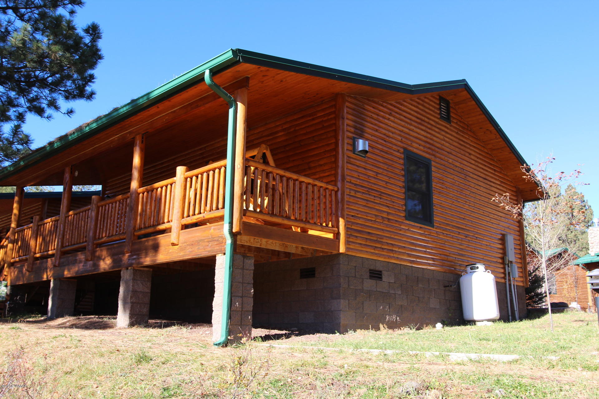 1120 Main, Unit 108 Greer, AZ 85927 - Photo 19 of 35 a front view of a house with a yard