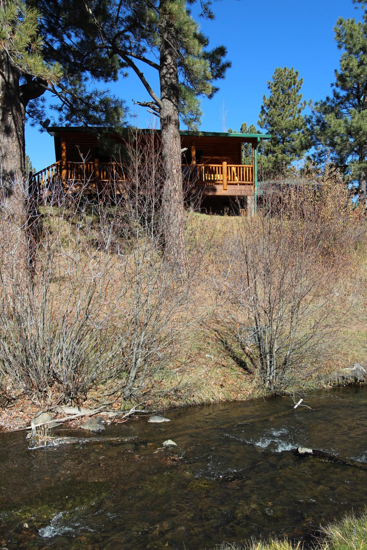 1120 Main, Unit 108 Greer, AZ 85927 - Photo 21 of 35 a view of a wooden fence
