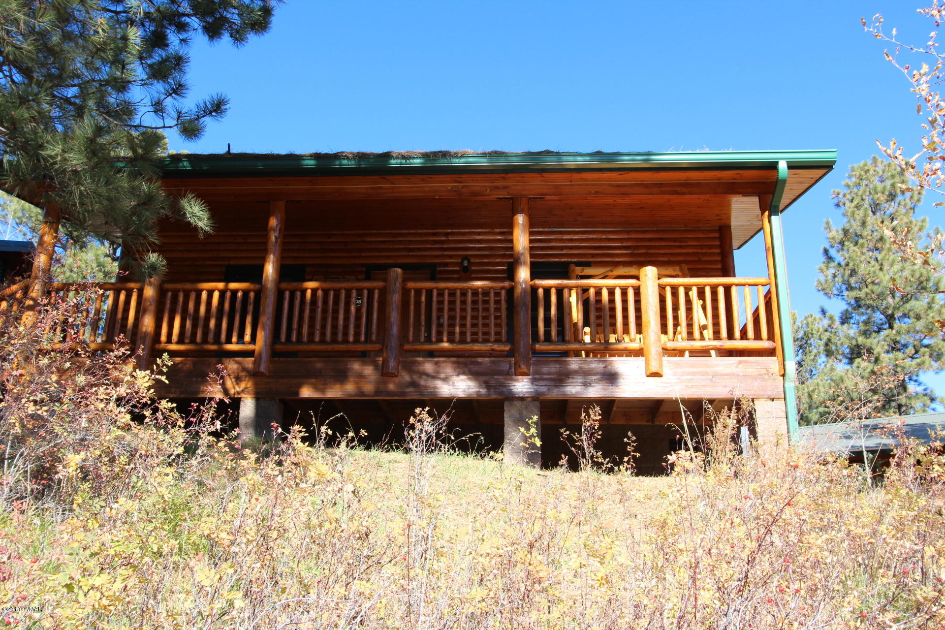 1120 Main, Unit 108 Greer, AZ 85927 - Photo 22 of 35 a view of a deck with a yard