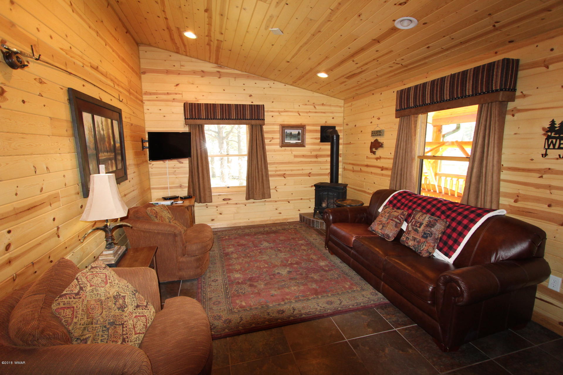 1120 Main, Unit 108 Greer, AZ 85927 - Photo 25 of 35 a living room with furniture and a large window