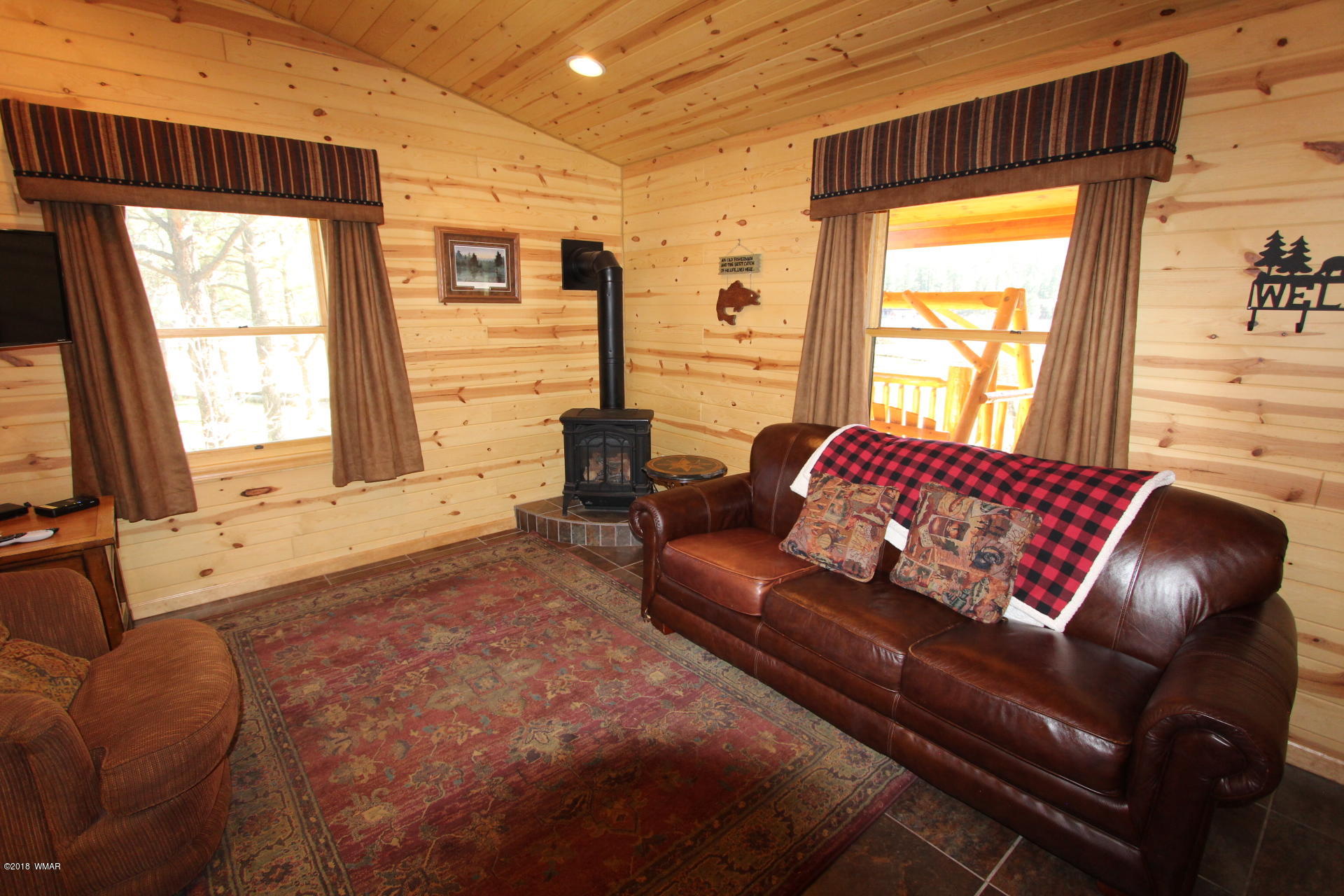 1120 Main, Unit 108 Greer, AZ 85927 - Photo 30 of 35 a living room with furniture and a window