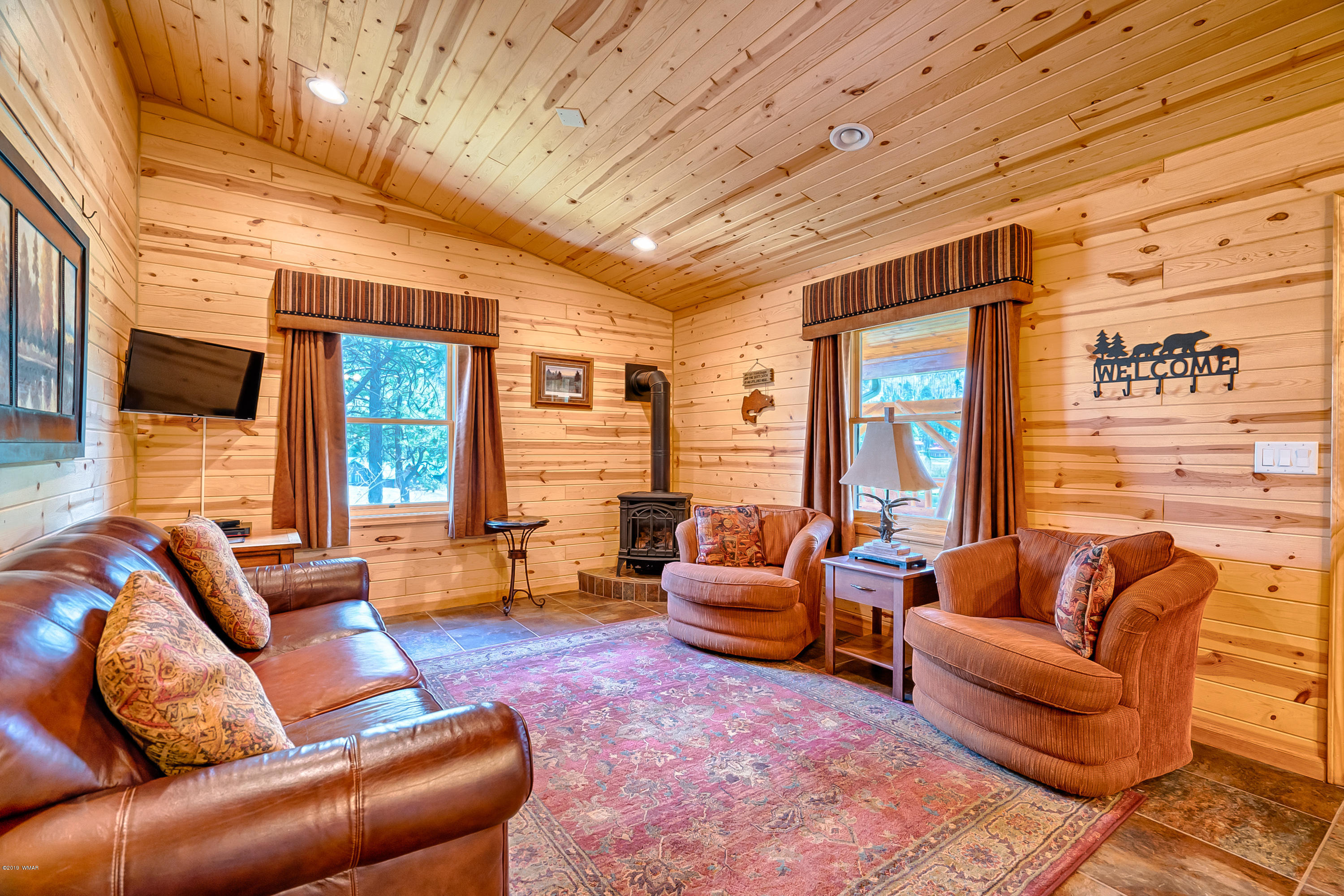 1120 Main, Unit 108 Greer, AZ 85927 - Photo 3 of 35 a living room with furniture and a large window