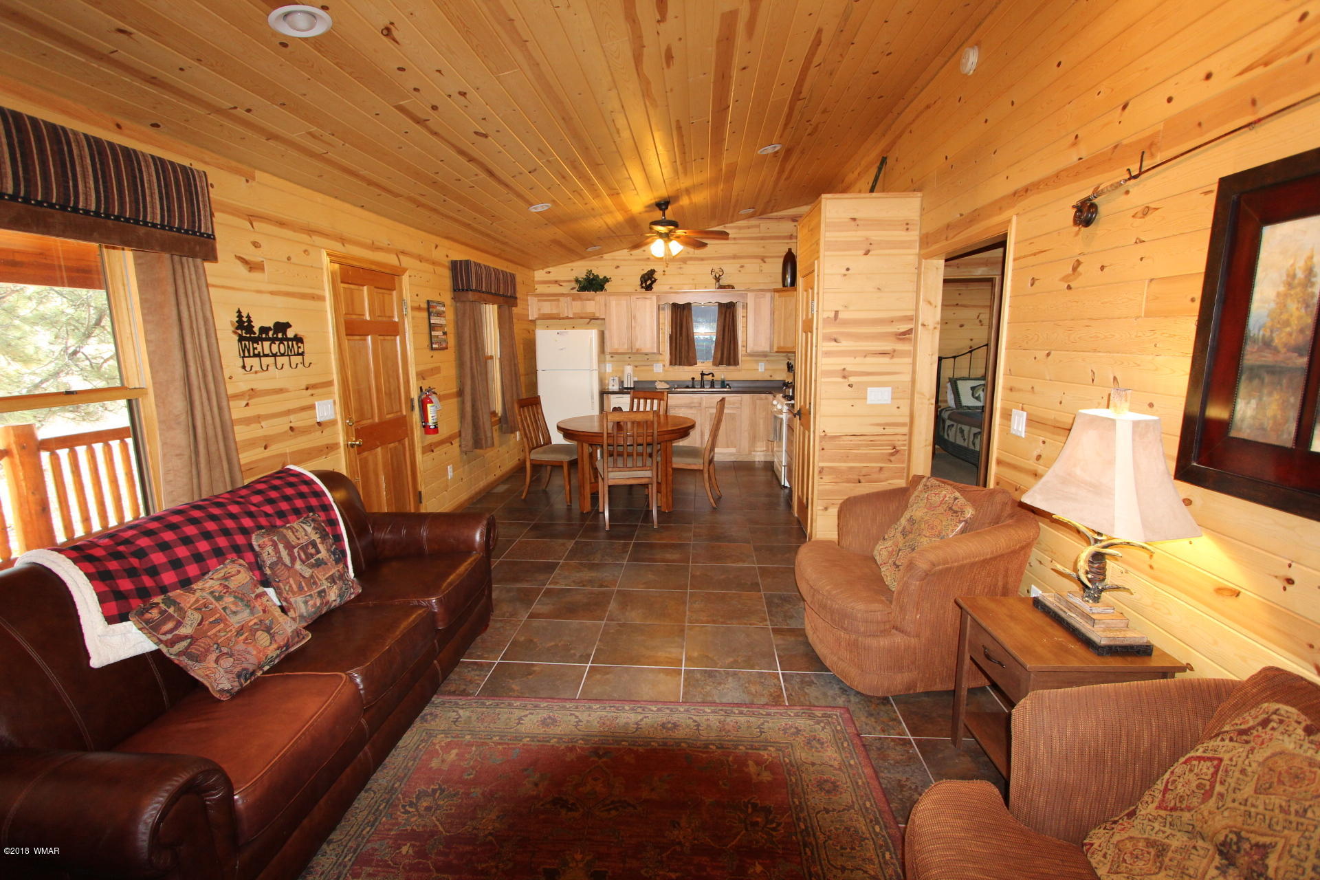 1120 Main, Unit 108 Greer, AZ 85927 - Photo 31 of 35 a living room with furniture and a large window