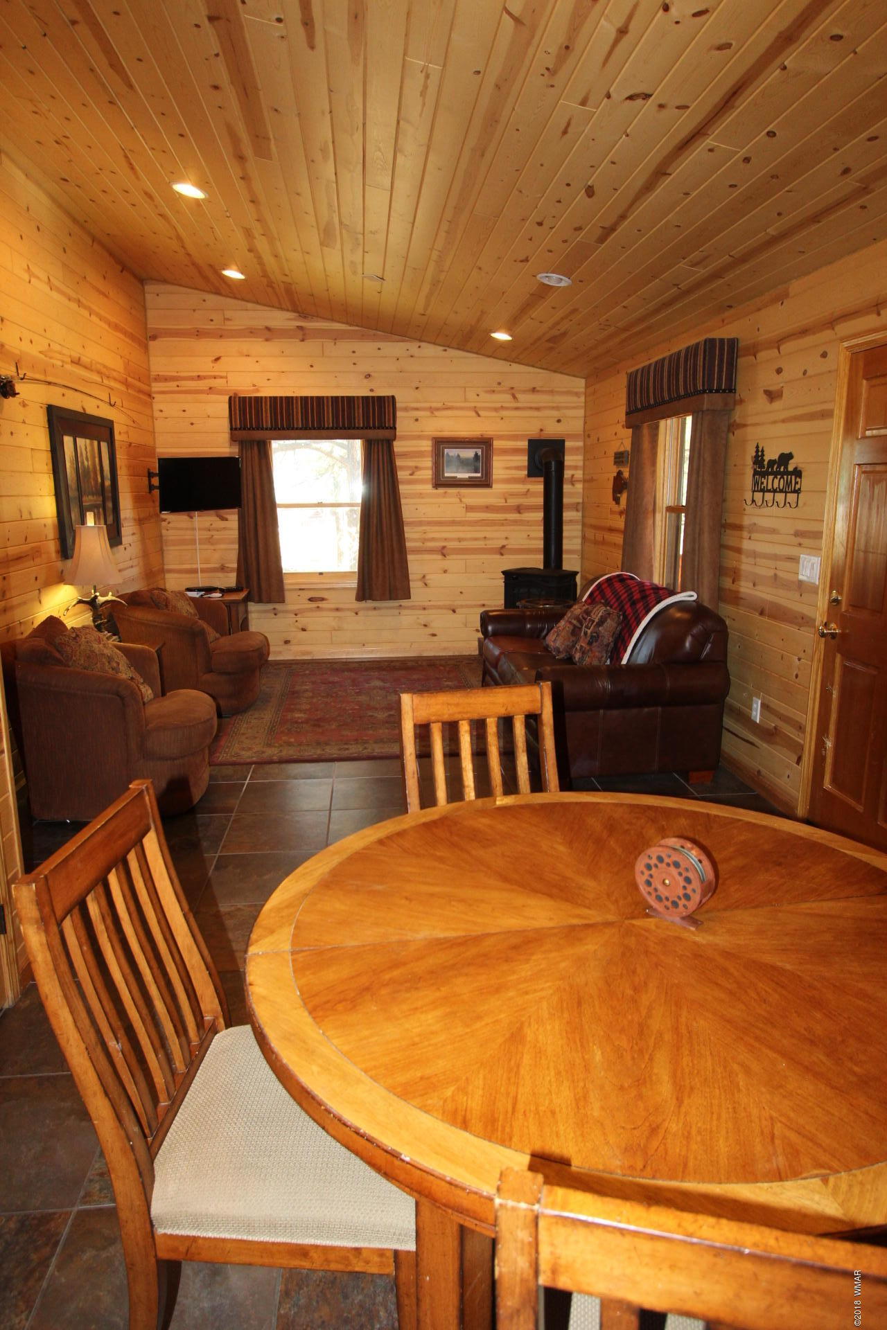 1120 Main, Unit 108 Greer, AZ 85927 - Photo 33 of 35 a living room with couches chairs and kitchen view