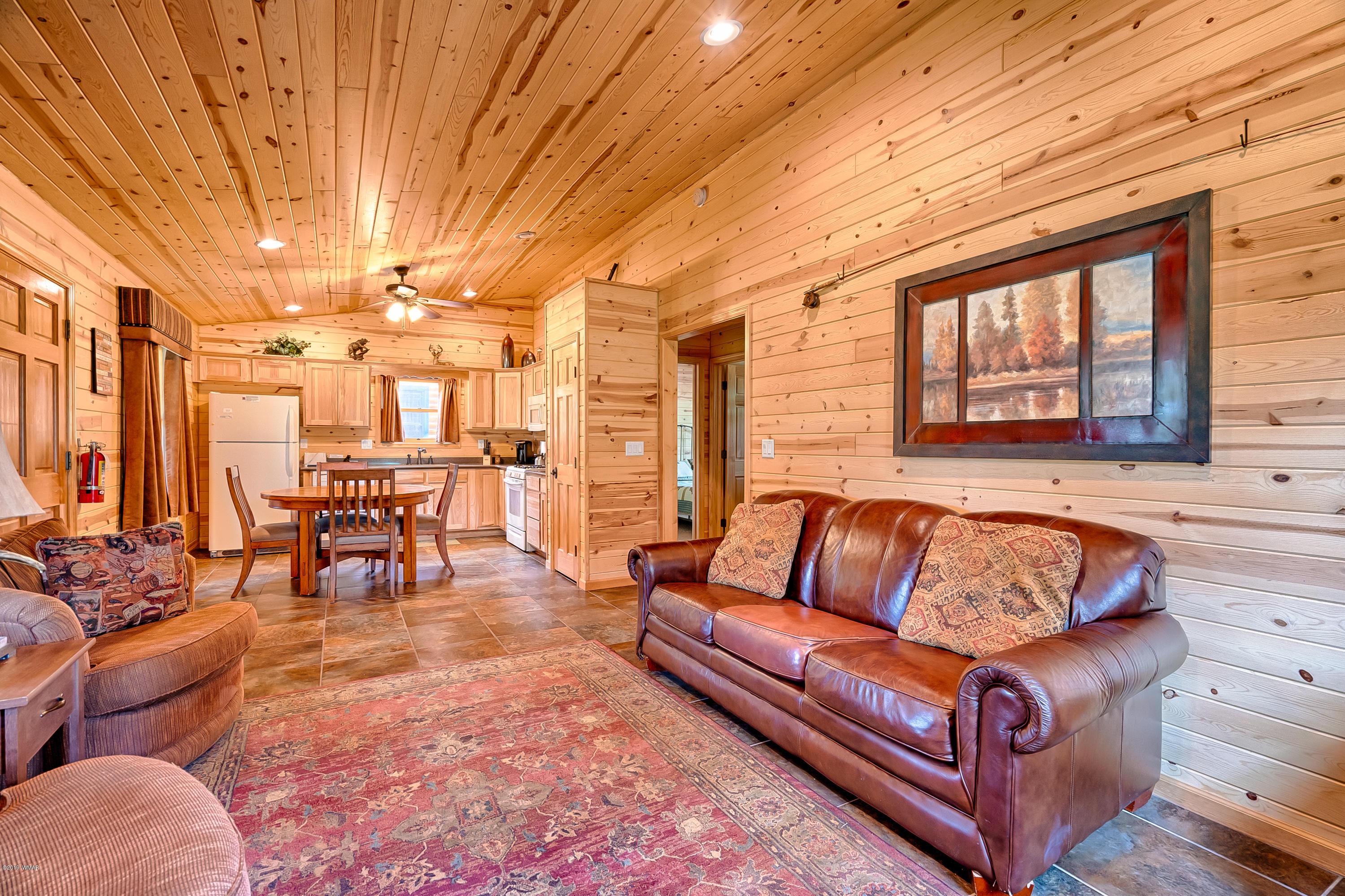 1120 Main, Unit 108 Greer, AZ 85927 - Photo 6 of 35 a living room with furniture and large windows