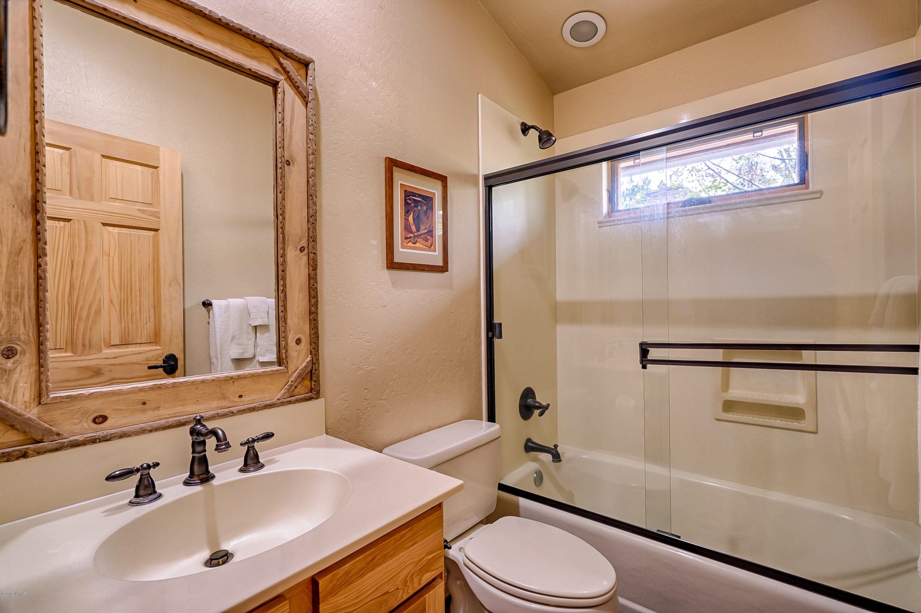 1120 Main, Unit 108 Greer, AZ 85927 - Photo 9 of 35 a bathroom with a sink toilet and shower