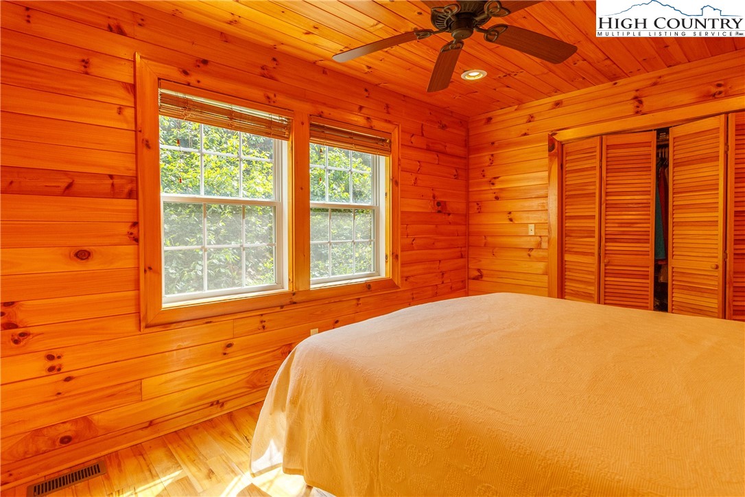185 Marc Street Boone, NC 28607 - Photo 11 of 30 a bedroom with a bed and a window