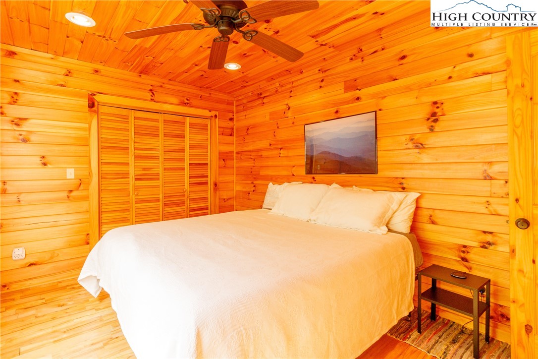 185 Marc Street Boone, NC 28607 - Photo 9 of 30 a bedroom with a bed and a painting on the wall