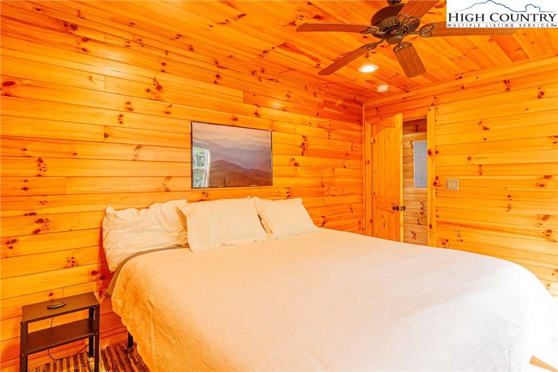 185 Marc Street Boone, NC 28607 - Photo 10 of 30 a bedroom with a bed and a night stand