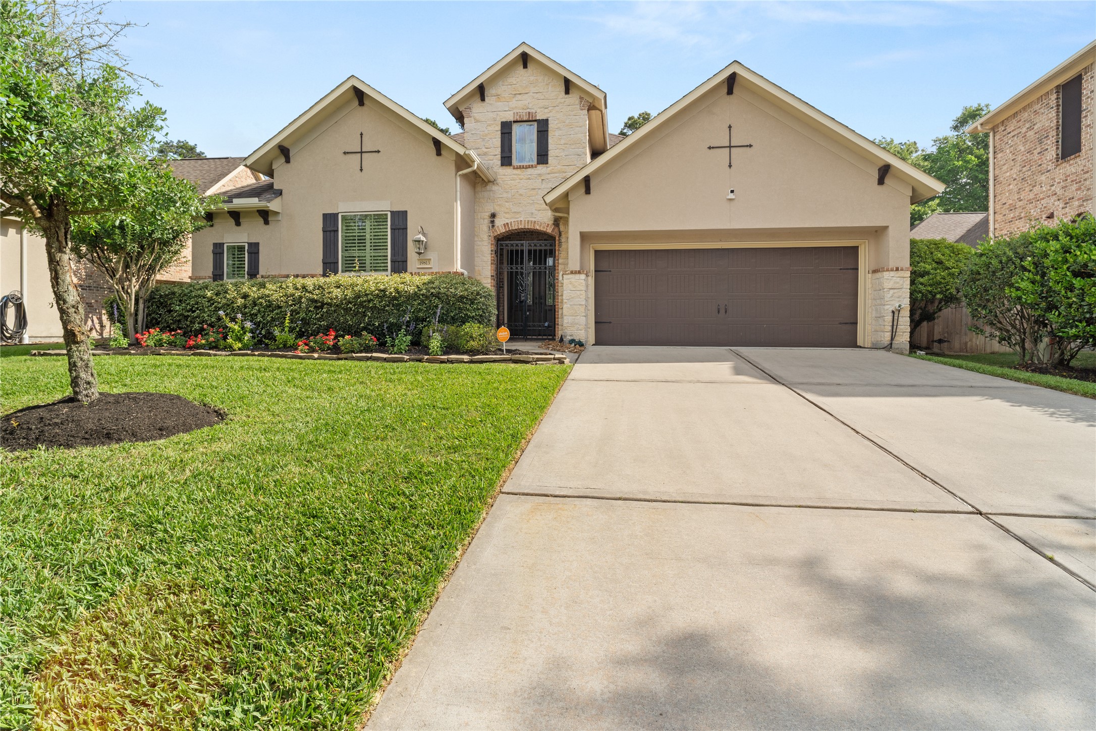 19813 Cullen Ridge Drive Porter, TX 77365 - Photo 3 of 44 Welcome to a charming home featuring a stylishly covered, gated front entry that offers both elegance and protection from the elements.