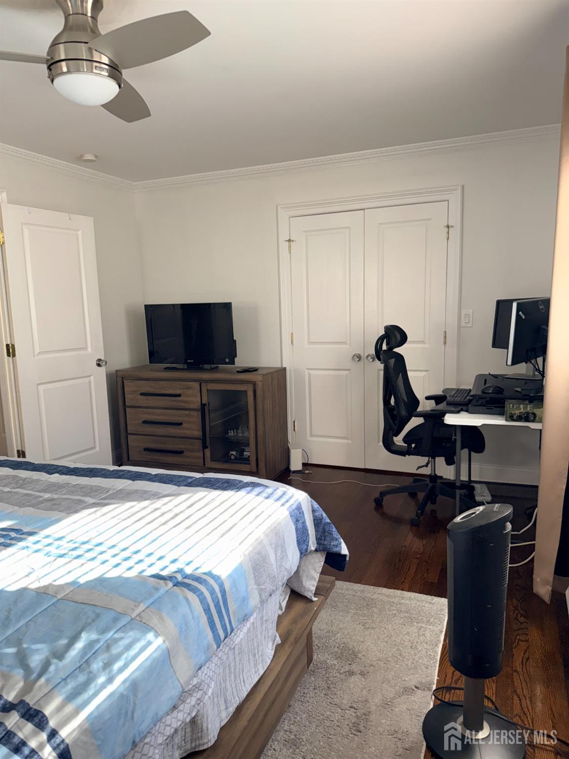 27 Rector Avenue Woodbridge, NJ 07095 - Photo 15 of 29 a bedroom with a bed and a flat screen tv