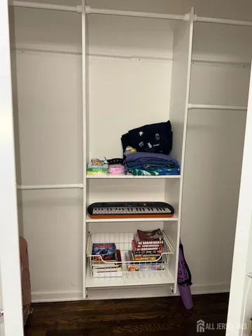 a view of a livingroom with furniture and floor to ceiling window