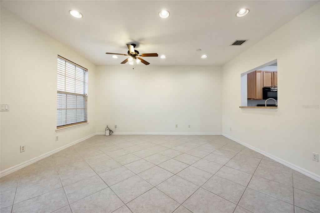 3956 Cherrybrook Loop Fort Myers, FL 33966 - Photo 11 of 44 wooden floor in an empty room with a window