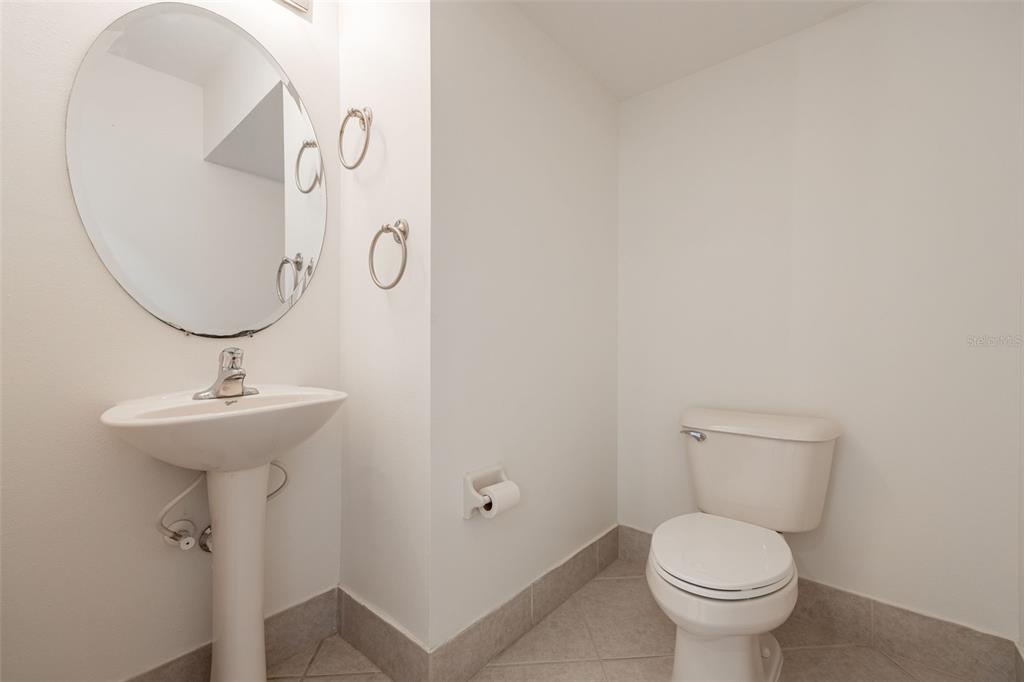 3956 Cherrybrook Loop Fort Myers, FL 33966 - Photo 16 of 44 a bathroom with a toilet sink and mirror