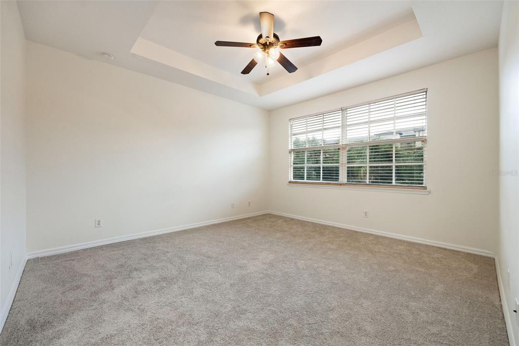 3956 Cherrybrook Loop Fort Myers, FL 33966 - Photo 19 of 44 an empty room with windows and ceiling fan