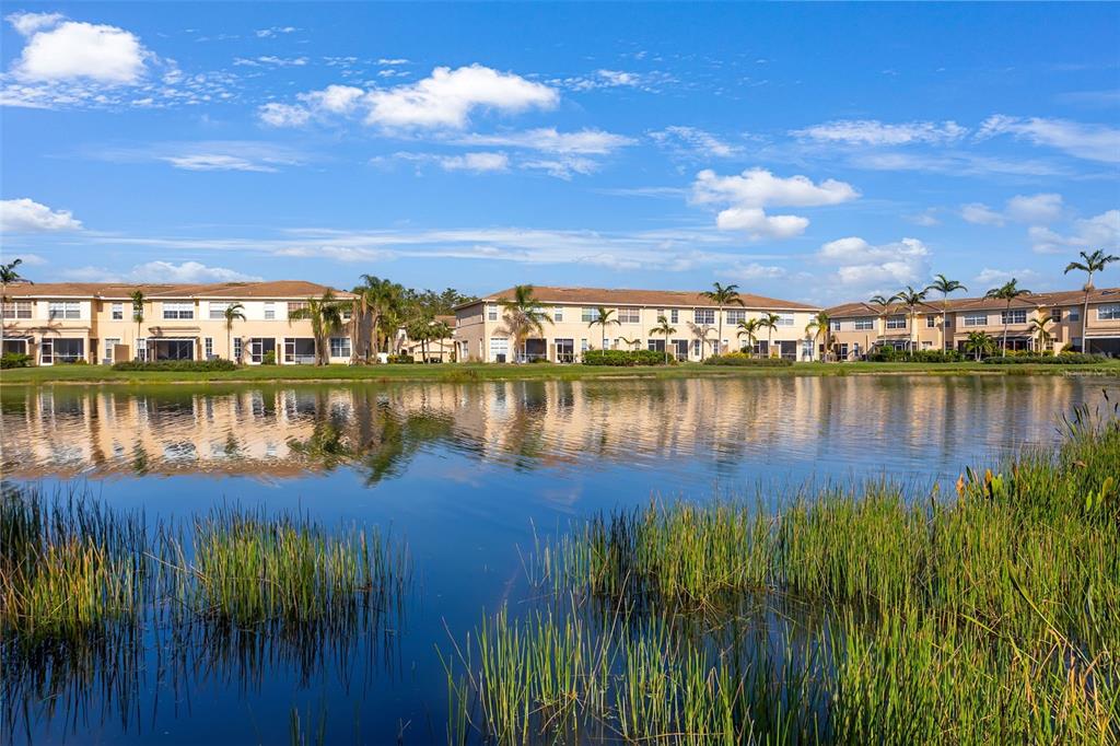 3956 Cherrybrook Loop Fort Myers, FL 33966 - Photo 40 of 44 a view of a lake with houses in the back