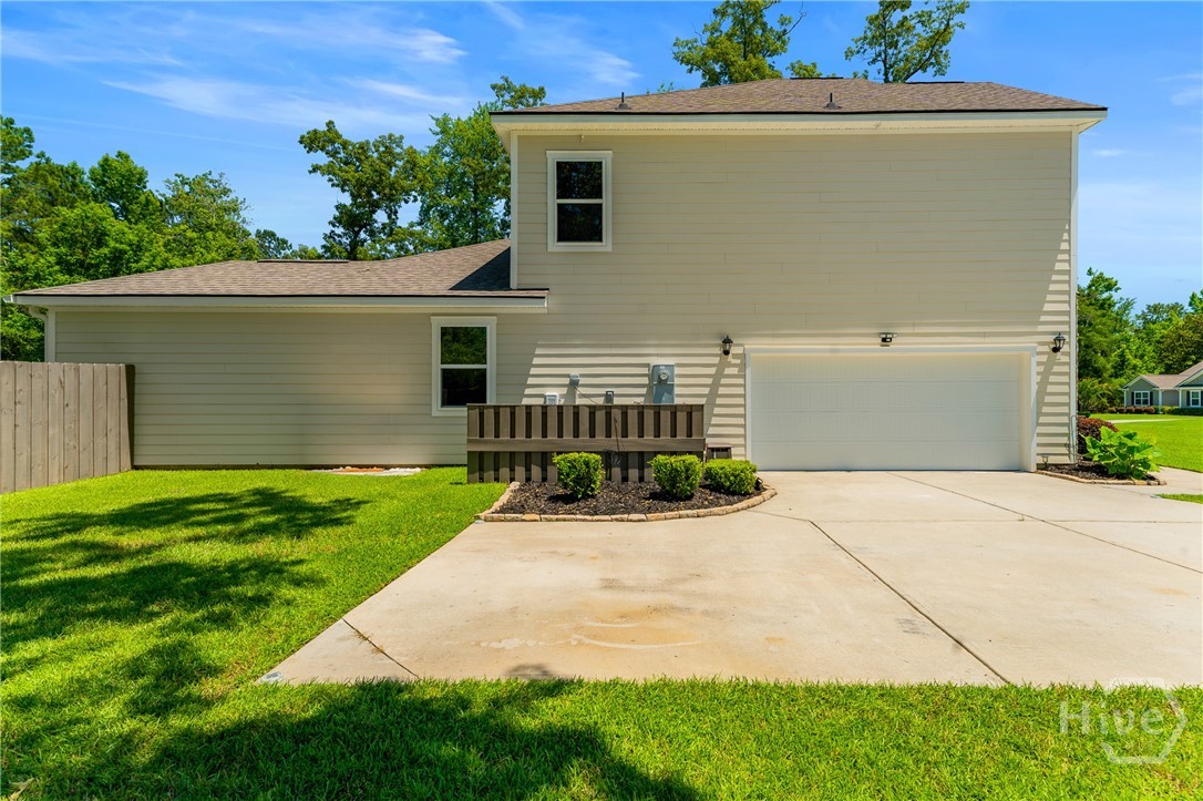 132 Ramsey Way Rincon, GA 31326 - Photo 58 of 59 A garage that actually fits two cars comfortably—no juggling required.