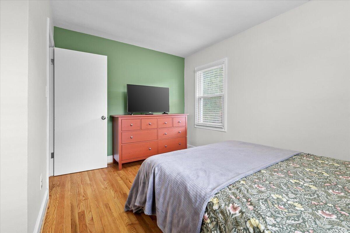 2025 Wayne Street Northeast Roanoke, VA 24012 - Photo 11 of 22 a bedroom with a bed and flat screen tv