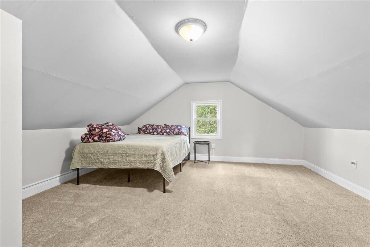 2025 Wayne Street Northeast Roanoke, VA 24012 - Photo 13 of 22 a bedroom with a bed and a window