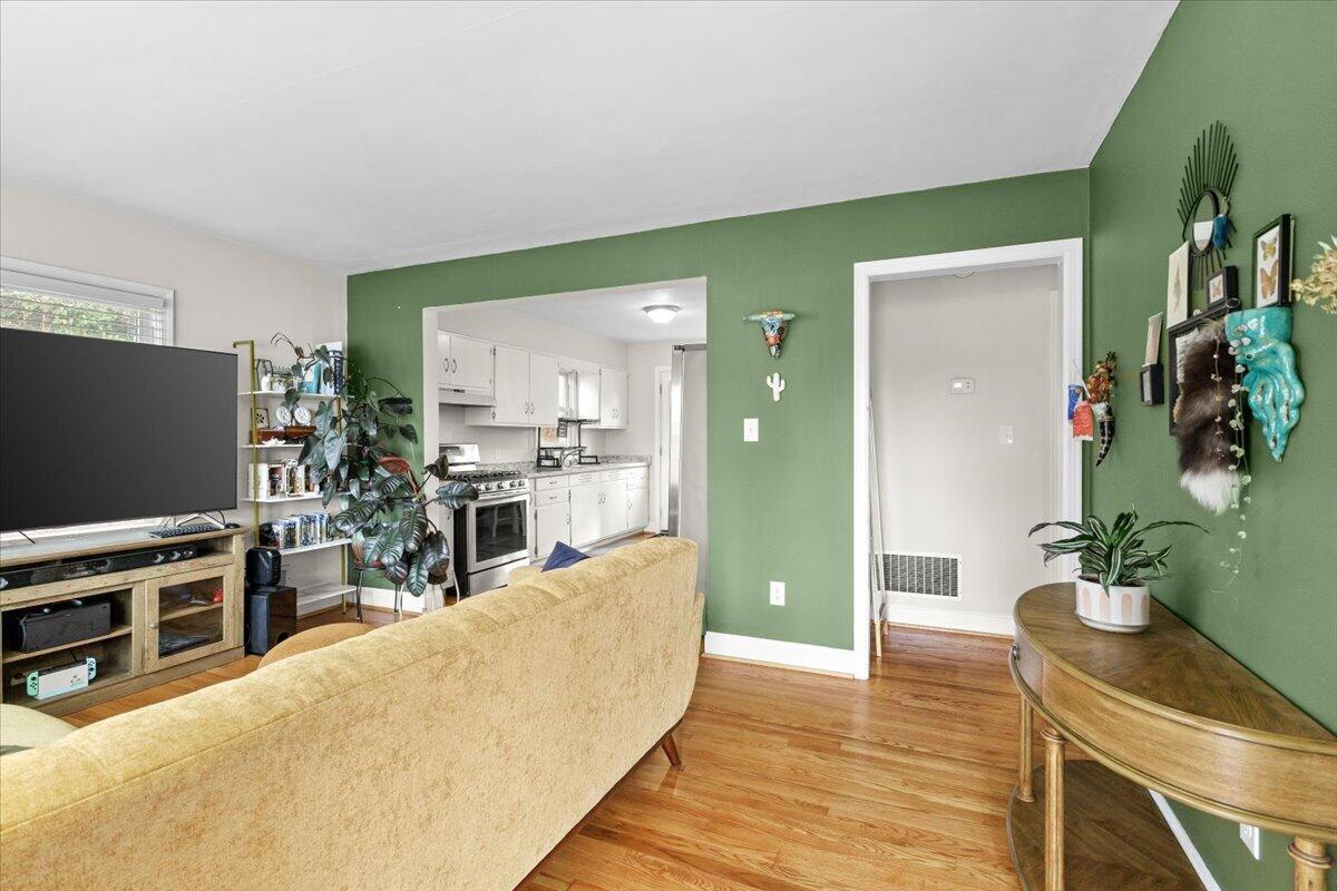 2025 Wayne Street Northeast Roanoke, VA 24012 - Photo 2 of 22 a living room with furniture and a flat screen tv