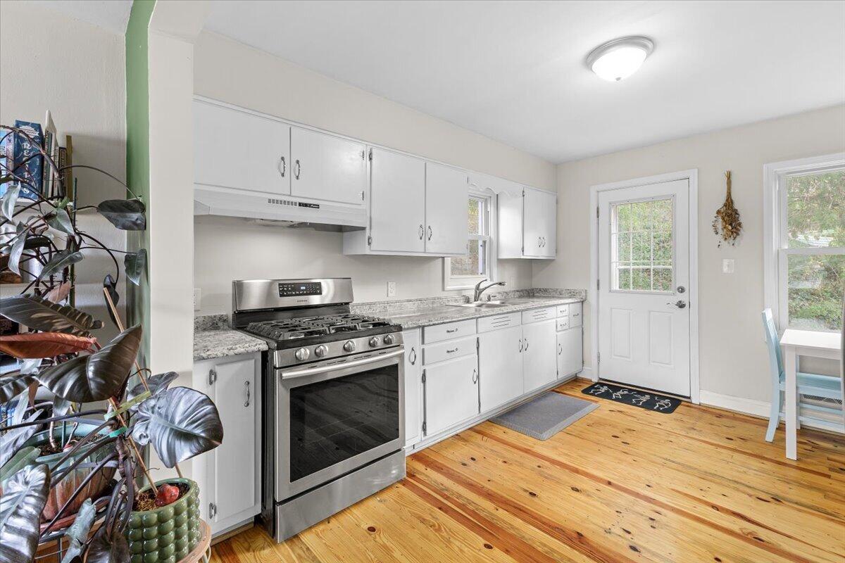 2025 Wayne Street Northeast Roanoke, VA 24012 - Photo 5 of 22 a kitchen with a stove oven and sink