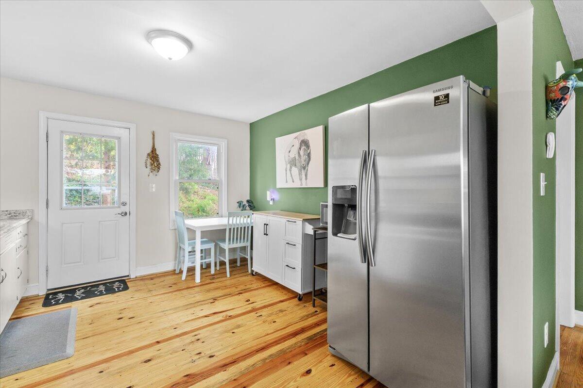 2025 Wayne Street Northeast Roanoke, VA 24012 - Photo 6 of 22 a kitchen with a refrigerator and windows