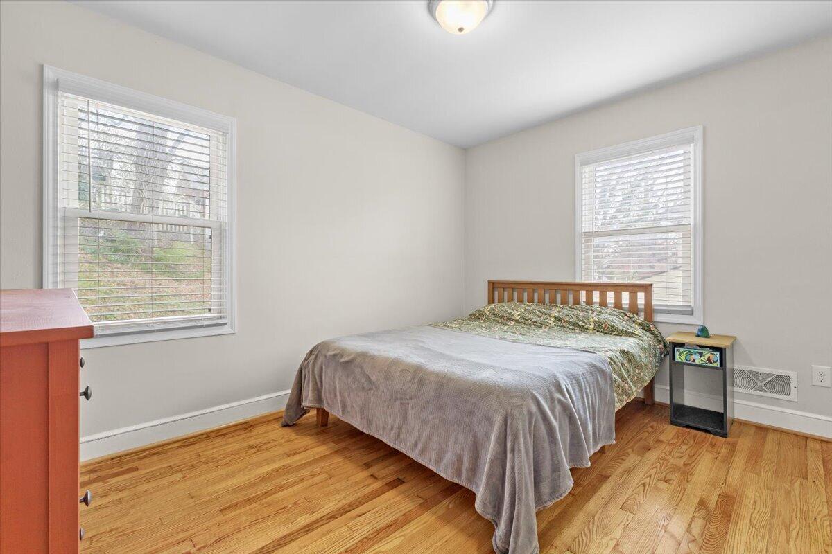 2025 Wayne Street Northeast Roanoke, VA 24012 - Photo 10 of 22 a bedroom with a bed and a window