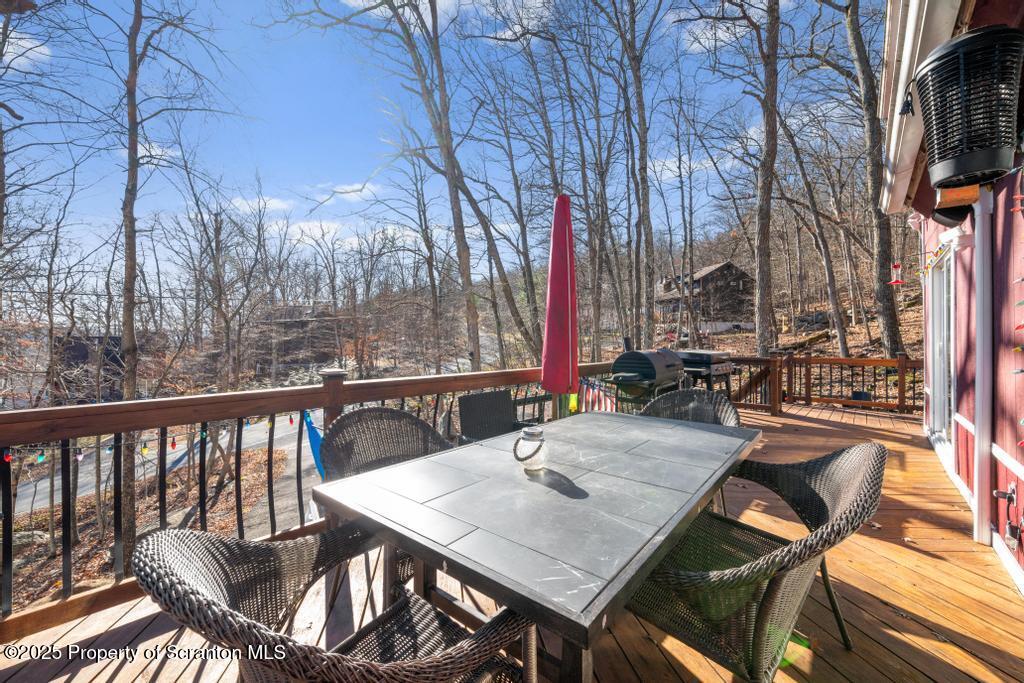 3110 Cherry Ridge Road Bushkill, PA 18324 - Photo 11 of 61 a view of a patio with table and chairs