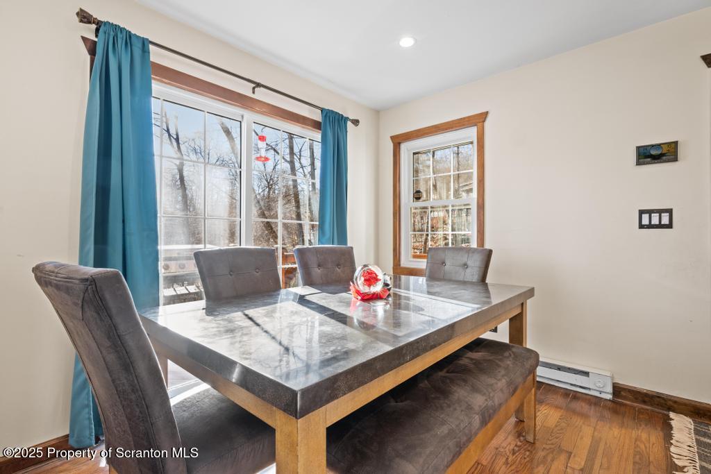 3110 Cherry Ridge Road Bushkill, PA 18324 - Photo 18 of 61 a dining room with furniture and wooden floor