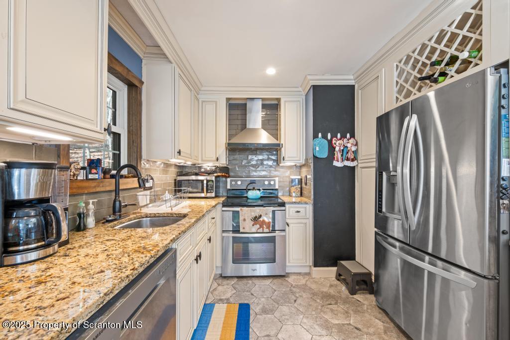 3110 Cherry Ridge Road Bushkill, PA 18324 - Photo 20 of 61 a kitchen with stainless steel appliances granite countertop a refrigerator a stove and a sink