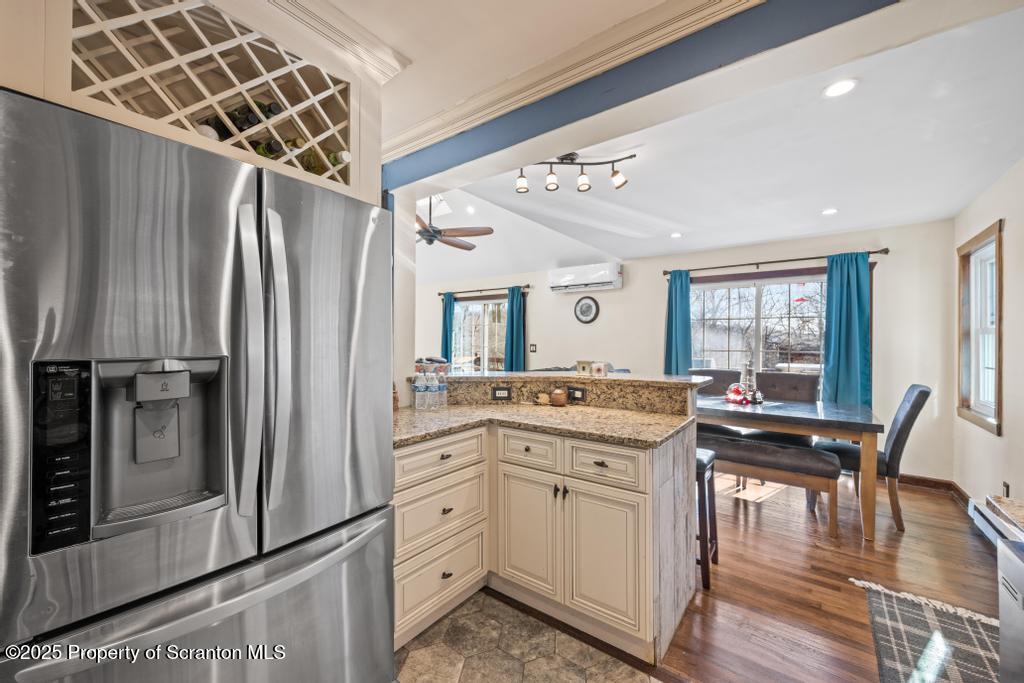 3110 Cherry Ridge Road Bushkill, PA 18324 - Photo 21 of 61 a kitchen with kitchen island white cabinets and stainless steel appliances