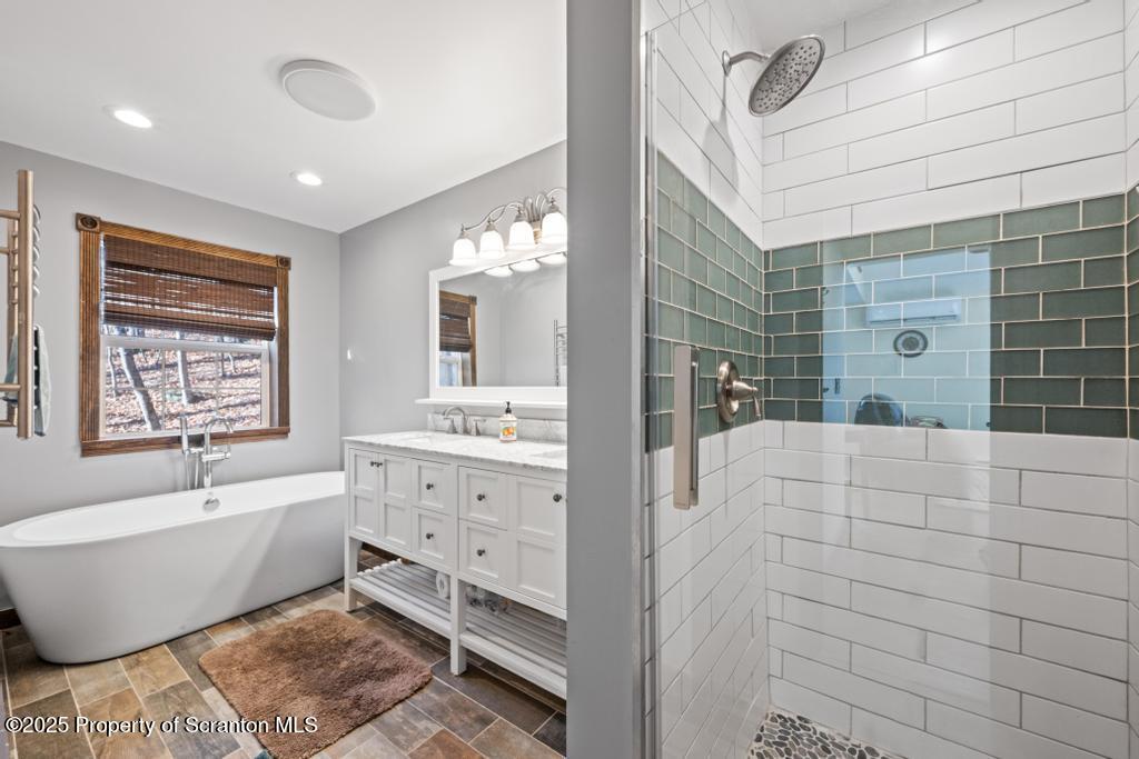 3110 Cherry Ridge Road Bushkill, PA 18324 - Photo 22 of 61 a bathroom with a bathtub and a sink