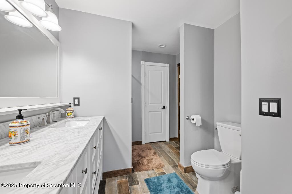 3110 Cherry Ridge Road Bushkill, PA 18324 - Photo 26 of 61 a bathroom with a granite countertop sink toilet and shower
