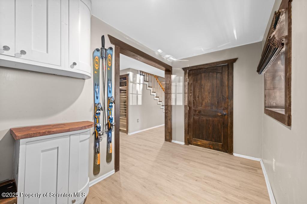 3110 Cherry Ridge Road Bushkill, PA 18324 - Photo 41 of 61 a view of empty room with wooden floor and cabinet