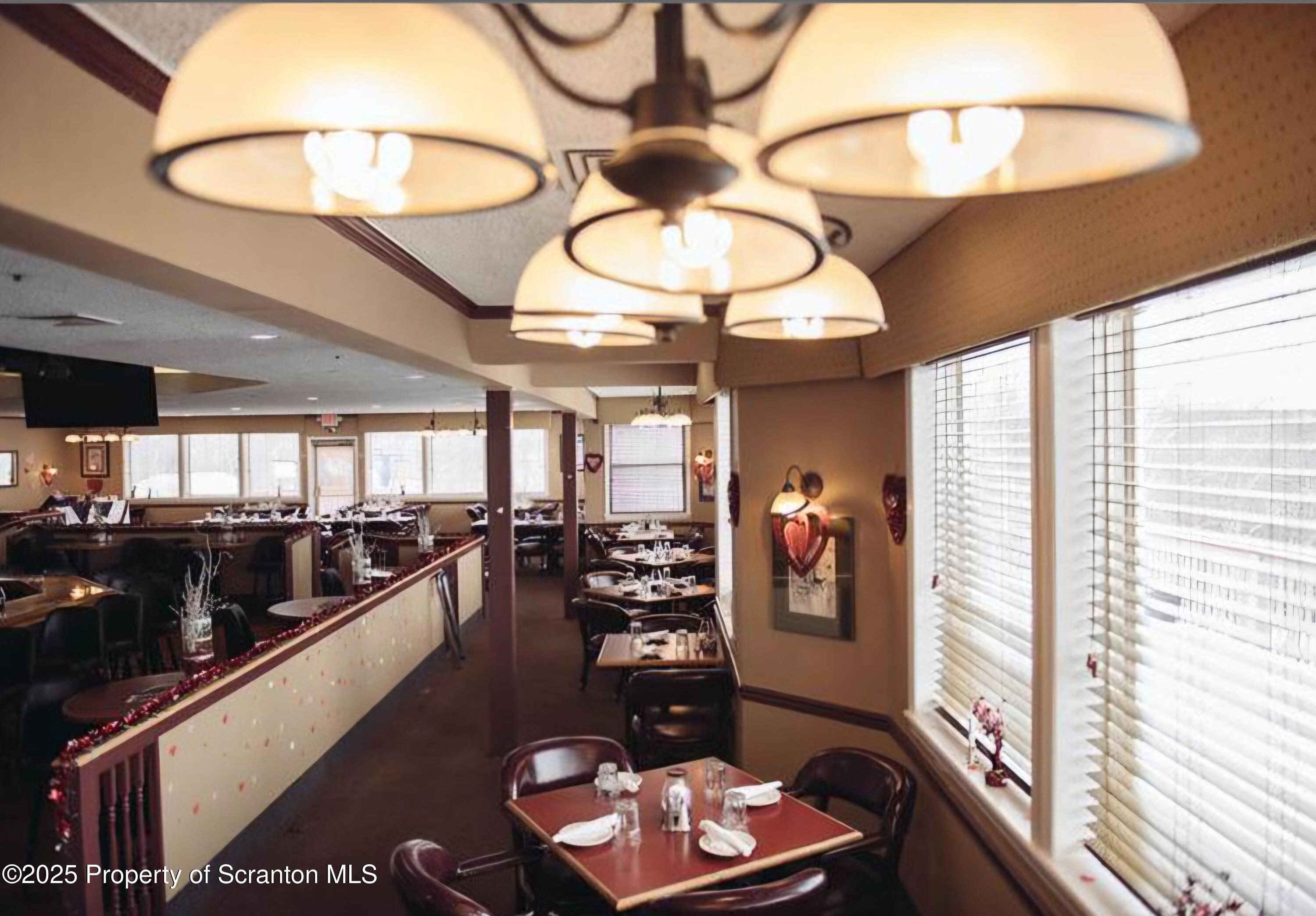 3110 Cherry Ridge Road Bushkill, PA 18324 - Photo 48 of 61 a very nice looking room with a large window and chandelier