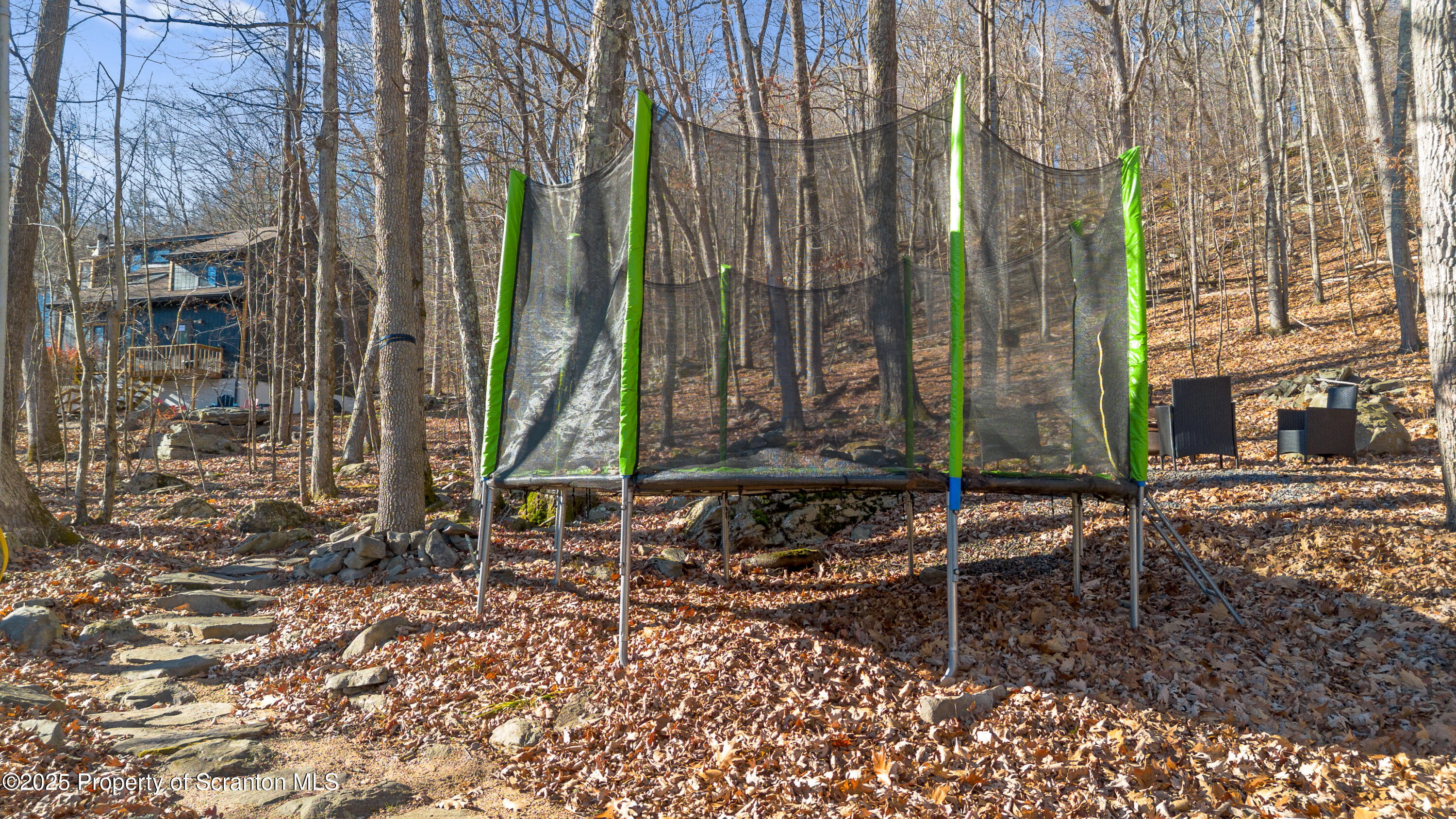 3110 Cherry Ridge Road Bushkill, PA 18324 - Photo 5 of 61 a backyard of a house with a table and chairs