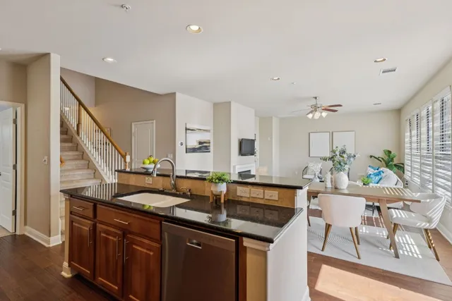 a kitchen with granite countertop a sink and cabinets