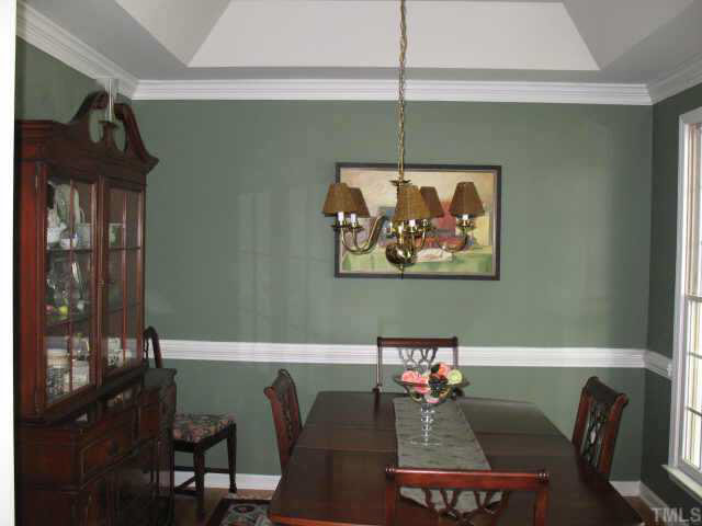 8501 Powis Circle Raleigh, NC 27615 - Photo 3 of 10 a view of a dining room with furniture and wooden floor