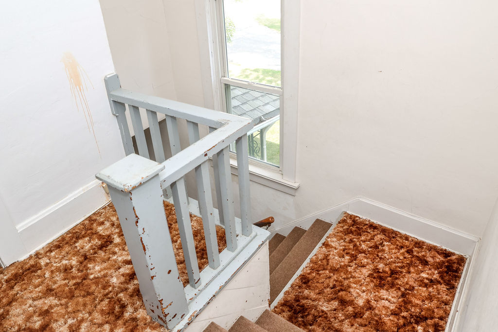 415 East Elm Street Chatsworth, IL 60921 - Photo 23 of 38 a view of staircase with white walls and a window