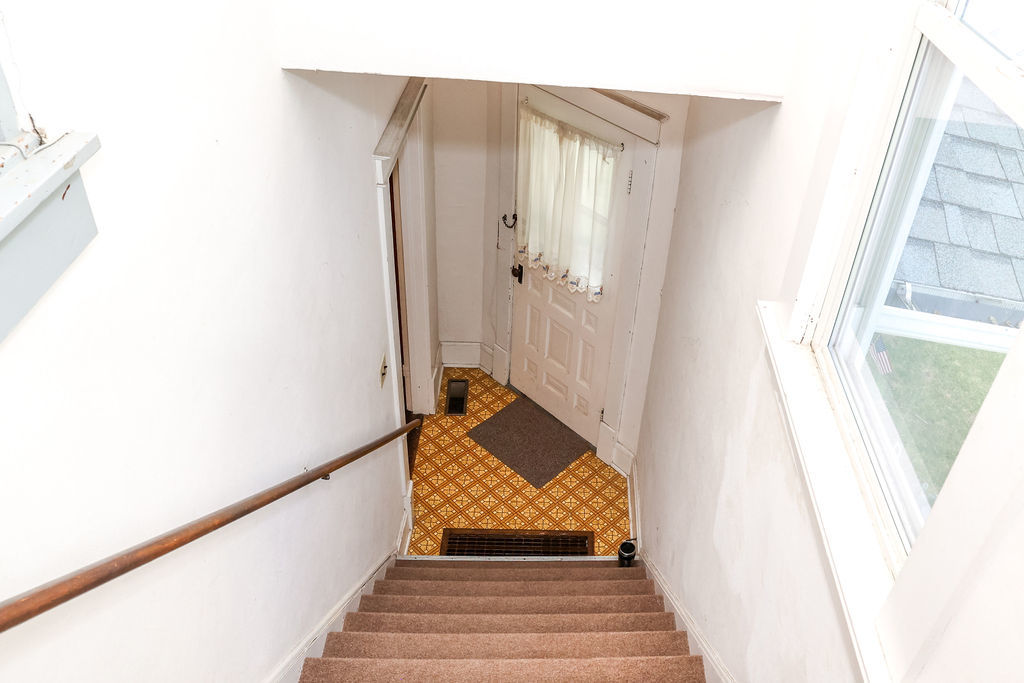 415 East Elm Street Chatsworth, IL 60921 - Photo 24 of 38 a bathroom with a sink and a mirror