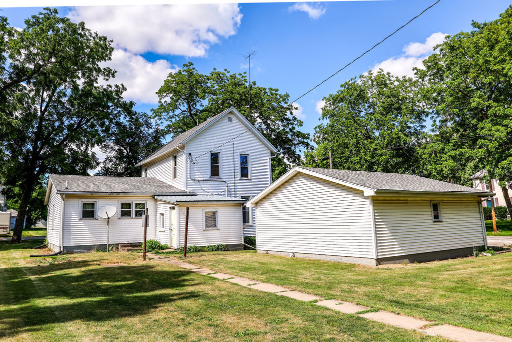 415 East Elm Street Chatsworth, IL 60921 - Photo 7 of 38 a view of a house with a yard patio and fire pit