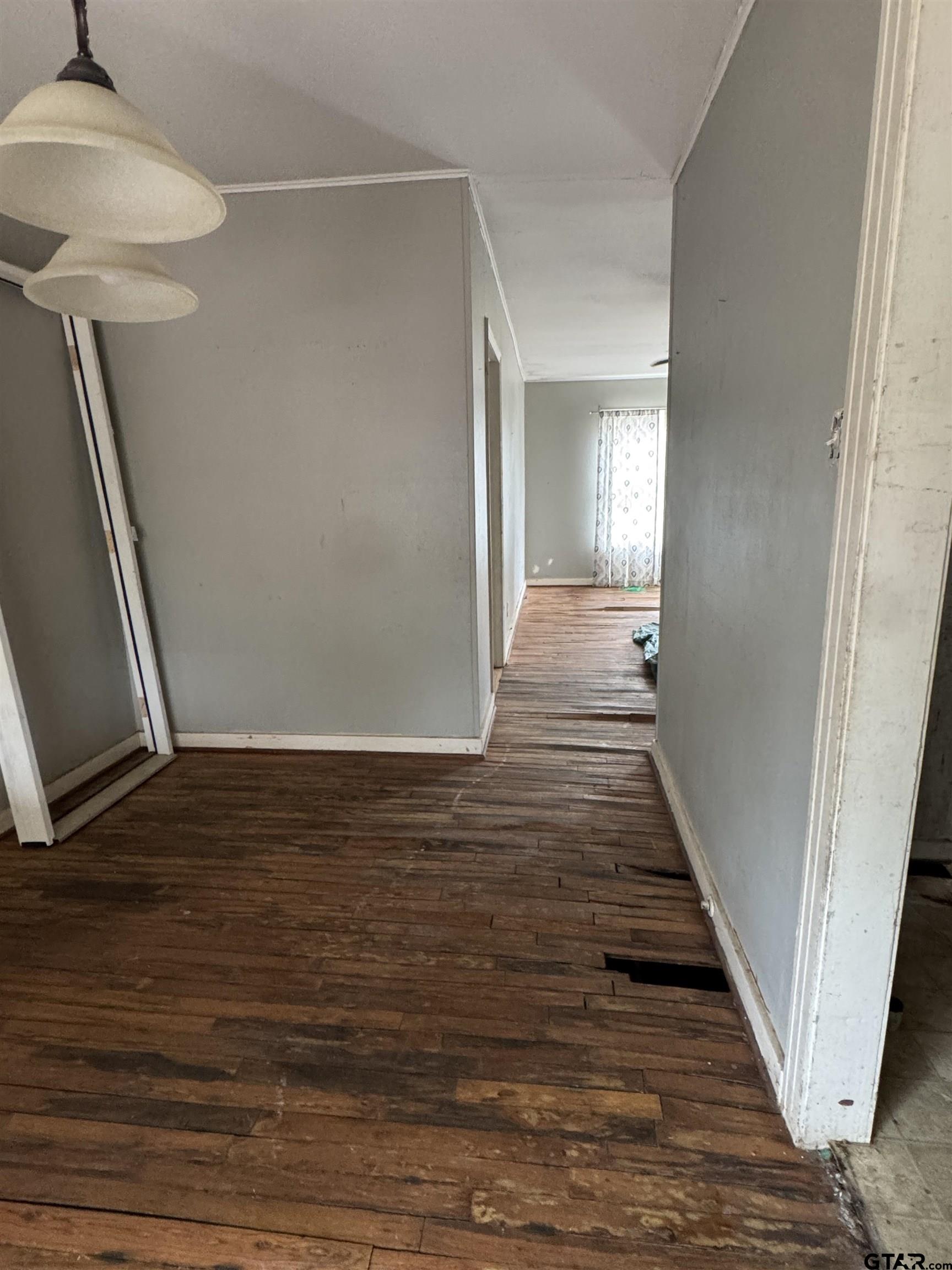 2927 New Copeland Road Tyler, TX 75701 - Photo 11 of 12 a view of a hallway with wooden floor