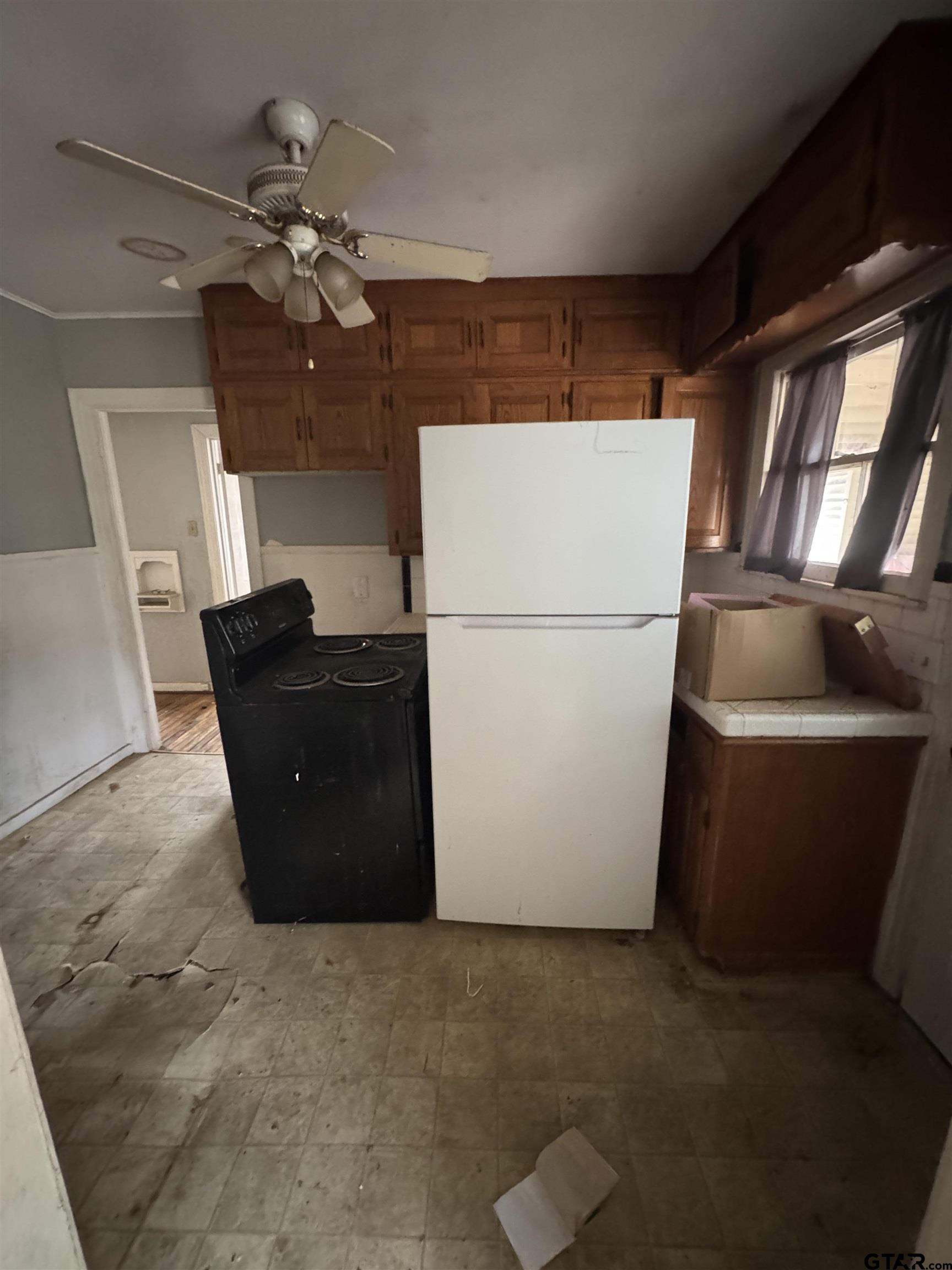 2927 New Copeland Road Tyler, TX 75701 - Photo 12 of 12 a refrigerator freezer sitting in a kitchen