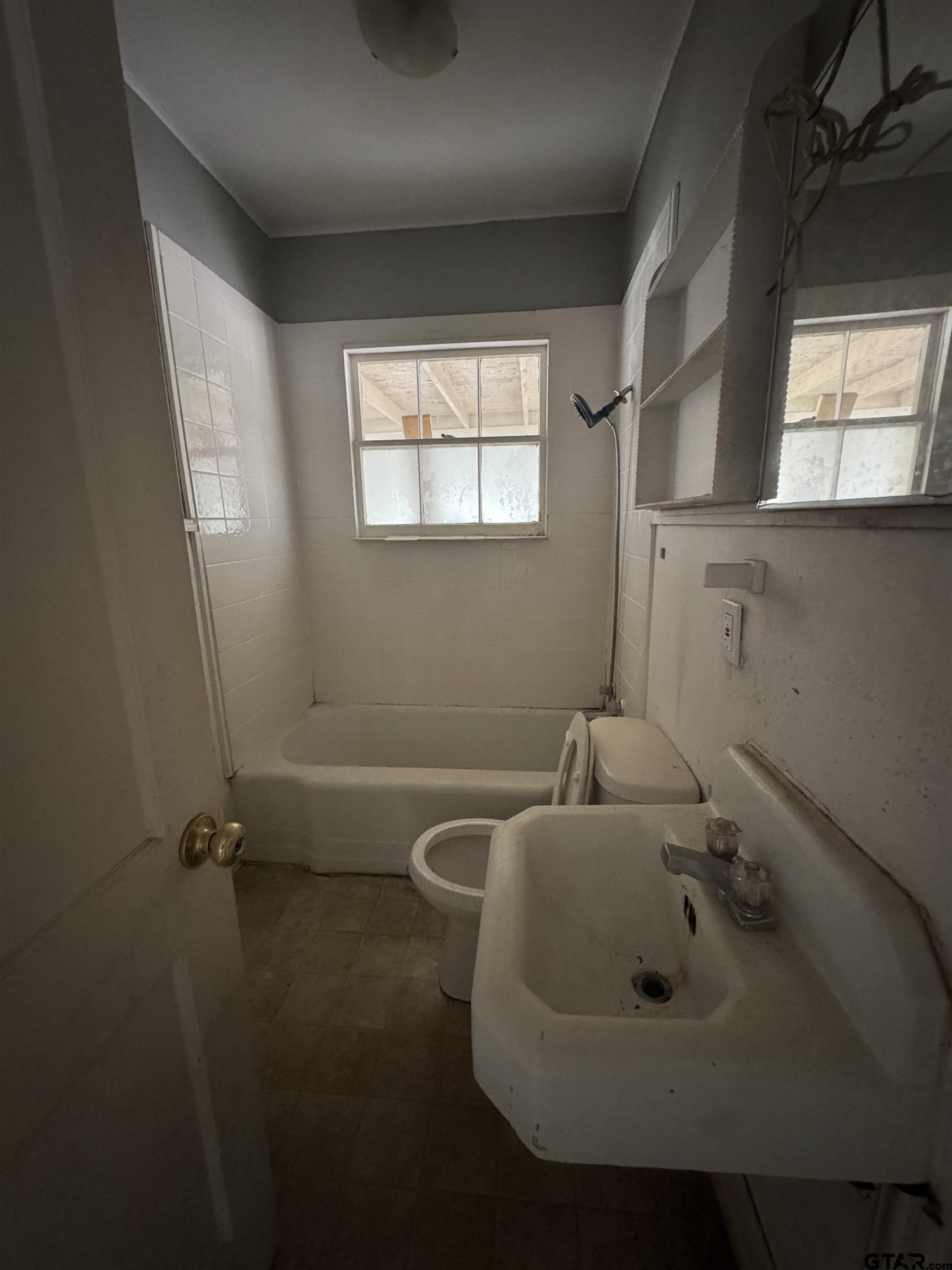 2927 New Copeland Road Tyler, TX 75701 - Photo 2 of 12 a bathroom with a sink and mirror