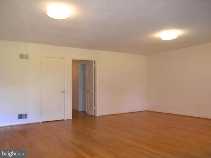 2074 Golf Course Drive Reston, VA 20191 - Photo 23 of 30 a view of an empty room and wooden floor